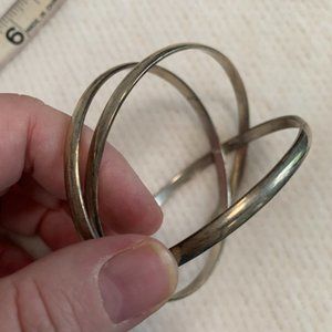 Three silver bracelets